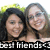 Two people with dark and light hair pose closely together against a blurred green background, smiling at the camera beneath pixelated text reading 'best friends' on black bars.