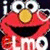 Red muppet character with large white eyes and yellow nose, smiling broadly against dark background.