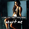 A woman with long dark hair sits on a chair, wearing a sleeveless top and shorts, with text overlaid on the image.