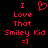 Red pixelated text and symbols on black background: 'I Love That Smiley Kid =]' with a heart symbol replacing the 'O' in 'Love'.