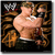 Pixelated static image of a shirtless man with light brown hair embracing a woman in dark clothing against a black background.