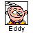 Pixelated cartoon character icon with pink skin, yellow shirt, purple bow tie, and spiky black hair inside a black square border, labeled "Eddy" below the frame.