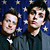 Animated contact sheet showing two frames of a buddy icon with two men against stars and a hand holding a red object under "American Idiot" text.