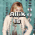 A pixelated image of a woman with long brown hair in a white top against a teal background with text reading "Alix Is".