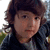 four pixelated images showing a person with brown curly hair in various poses and text overlays including "Frank," "The Tank," and "THE MAN <333333" on white backgrounds
