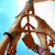 Animated sequence showing hands forming peace signs against a blue sky, followed by colored peace signs and a peace sign with floral accents.