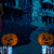 Four pumpkin icons in a horizontal row on a dark blue background with large stylized letters above them, each showing different facial expressions and lighting effects across two sampled frames.