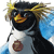 Pixelated cartoon penguin with black head, white chest, and orange beak, wearing a golden crown and blue shoulder accents, holding a brown circular object.