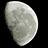 A static image shows a gray crescent moon on black background with red pixelated text reading 'In The Night The Creatures Crawl In The Dark The People Sqwirm In The Woods The Monsters Feed' in three