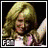 Two side-by-side pixelated images of a blonde woman with long hair, first smiling and looking down-left, then shouting or singing with mouth open.
