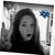 A grayscale image of a person with long dark hair making a peace sign, wearing a black top and blue flower accessory.