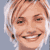 Static pixelated icon of a smiling person with light brown hair and white highlights against a gray background.