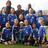 A pixelated group photo of people in blue sports uniforms with overlaid pixelated text on a black background.