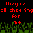 Red pixelated text on black background reads 'they're all cheering for me' above green pixelated crowd with raised arms.