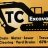 Pixelated image showing large 'TC' letters with a vehicle silhouette on a yellow background, below which are indistinct horizontal bars.