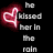 A black background displays a red heart symbol and white text reading 'He kissed her in the rain and said I'm here. I'll never leave' with an animation showing text changing to 'he wiped her tears away'.