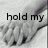 Black-and-white image of two hands clasped together with text fragments 'hold my', 'hand and never', and 'let go' overlaid in a