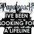Black-and-white animated icon featuring a figure with raised arms and text blocks reading "I'VE BEEN LOOKING FOR A LIFELINE," "THOUGH IT SEEMS LIKE A LIFETIME," and "M DROWNING IN THE PAIN." The animation shows the figure's pose changing across frames.