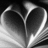 Black-and-white heart-shaped icon with layered, curved lines forming a symmetrical design against dark background.