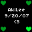 Pixelated green heart icons and white text reading 'AkiLee', '9/20/07', '<3' on a black background with animated heart arrangements.
