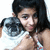 A person with long dark hair wearing a white sleeveless top holds a small dog, showing subtle pose changes across frames.