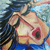 Pixelated image of a stylized figure with light skin, dark hair, and red lips against a blue background.