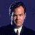 A pixelated image of a person in formal attire with a green background displaying 'Original Icons .com' text.