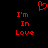 Red pixelated text 'I'm In Love' appears twice on black background with red heart symbol above center.