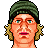 Pixelated cartoon-style icon of a person with green hair, blue eyes, and pink lips against white background.
