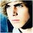 Static 48x48 pixel buddy icon showing a stylized male face with dark hair, blue eyes, and red lips against a gradient background transitioning from brown to blue.