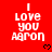 Red background with white pixelated text reading "I LOVE YOU AARON" and small black heart symbols, arranged in a pattern with a gray rectangular overlay on the bottom right