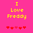 Yellow pixelated text "I Love Freddy" on bright pink background with red heart symbols below.