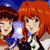 Two pixelated figures with distinct hair colors stand side-by-side against a blue background with a small white shape.