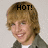Pixelated image of a person with light brown hair wearing dark clothing, featuring bold black text "HOT!" above the head against a neutral background.