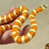 A 4-frame contact sheet showing a snake and text animation with alternating frames of a hand holding a snake and the text 'CoolBuddy.com' on blue background.