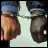 pixelated images showing hands clasped with 'UNITED WE STAND' text, where the letter U in UNITED cycles through red, blue, and white colors across frames