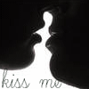 Black-and-white silhouette of two figures kissing with 'Kiss Me' text below, rendered in low-resolution pixel art style.