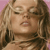 Pixelated close-up of a person with light brown hair and closed eyes against a pink background.