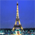 Pixelated static image of a tall tower with a lattice structure against a blue sky, base near water with blurred colors.