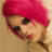 Pixelated image of a person with bright pink hair and dark eyes, next to text reading 'Jeffree Star' above a red heart symbol on black background.