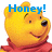 Pixelated yellow bear head with red clothing, blue text 'Honey!' above, smiling expression, black nose, brown eyes, and a single raised eyebrow.