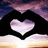 A static image shows hands forming a heart shape over a sunset sky with green text reading "I Love Frank" on a pink background.