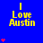 Blue background displays yellow text "I Love Austin" with red heart symbols appearing in vertical across the