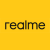 Yellow background with pixelated black text reading 'realme' in lowercase letters, each character formed by blocky pixels.