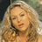Four pixelated show a woman with long curly hair in different poses and lighting, each cropped to focus on her face and upper shoulders