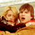 Static 50x50 pixel buddy icon showing two people in a close-up pose with warm lighting and visible pixelation.