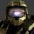 Pixelated close-up of a character in gold armor with a helmet, featuring a bright white light on the visor against dark background.