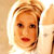 Static 50x50 pixel icon showing a close-up of a person's face with light brown hair and red lips against a bright background.