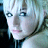 Static 48x48 pixel icon showing a close-up of a person's face with light-colored hair and blue eyes, rendered in low-resolution pixel art style with visible dithering and color blending.