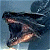 A pixelated figure in dark clothing with light-colored limbs appears to be in motion against a blue background.